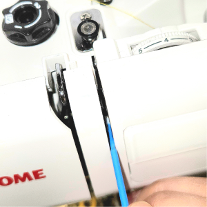 Picture of cleaning and upper tension of a sewing machine using a micro brush